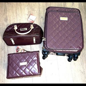 3pcs Joy & Iman Burgundy Quilted Suitcase, Tote and Cosmetic Rollup Tote.